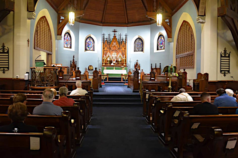 sanctuary of church with people in the pews